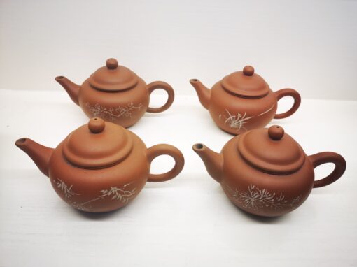 Four horizontal red clay teapot set