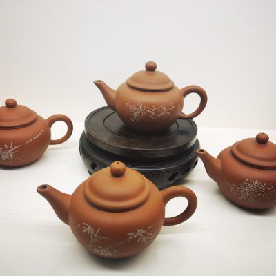Four horizontal red clay teapot set
